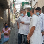Venezuelan and Cuban doctors advise a person not waring a mask. April 2020