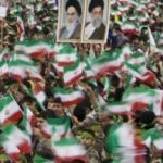 Millions celebrate the Revolution with the portraits of the revolutionary leaders: Khomeini and Khamenei